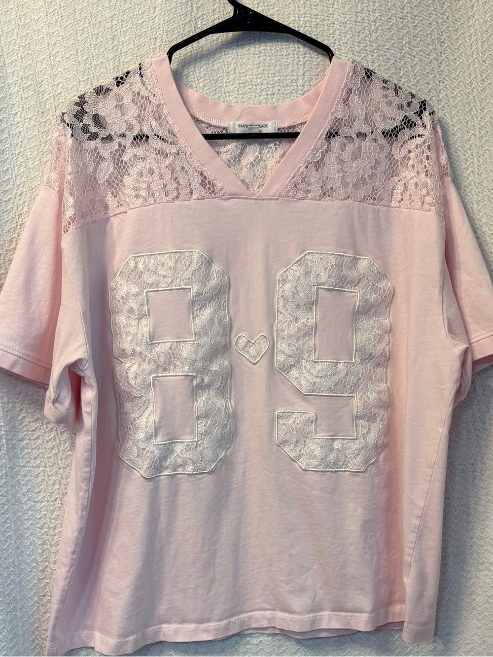 Grayson Threads Women’s  89 lace jersey graphic T-shirt in soft pink.   Size L